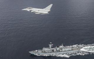 An RAF Typhoon aircraft and Royal Navy frigate in action on the North Sea