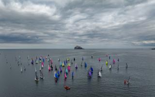 Noble Marine Rooster National RS200 Championships 2023 at East Lothian Yacht Club; Fleet sailing downwind with Bass Rock. Image: Steve Fraser