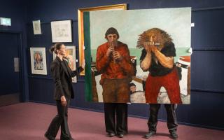 Auctioneer Amy Cameron with John Bellany's The Players